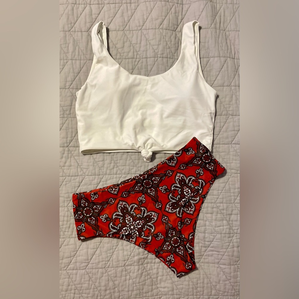 Two peice swim suit. High waisted bottoms and knot front top.